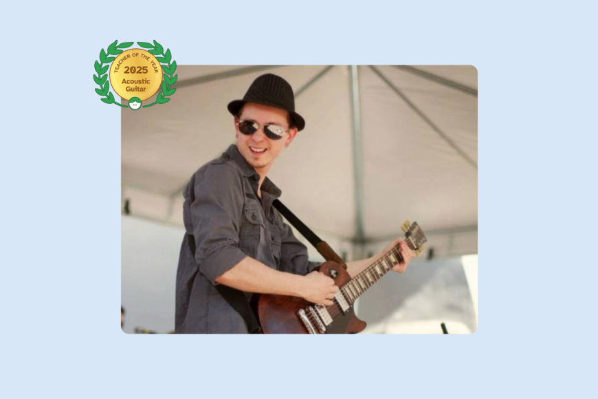 Image of Derek Gonzales playing the guitar on stage