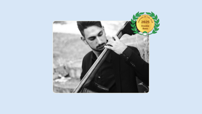 Image of David Jerkovic playing the Double Bass with his Lessonface Teacher of the Year Badge for Double Bass