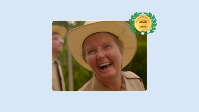 Image of Stephanie Barton-Farcas acting with her Lessonface Teacher of the Year Badge