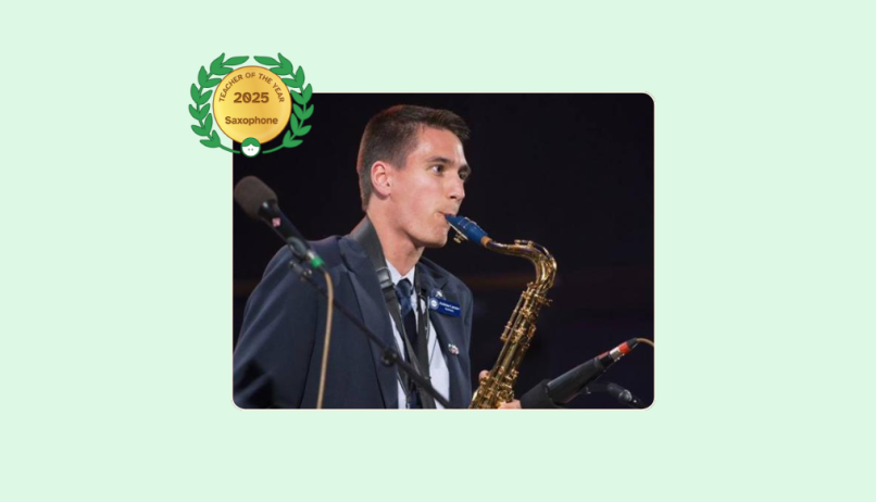 Image of Andrew Larsen playing the Saxophone while performing on stage