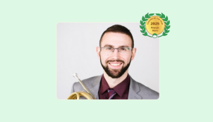 Image of Olivier Blakney with his French Horn and Lessonface Teacher of the Year badge