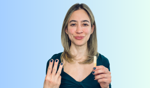 Image of Liz Ramirez holding the number 3 and a clarinet reed