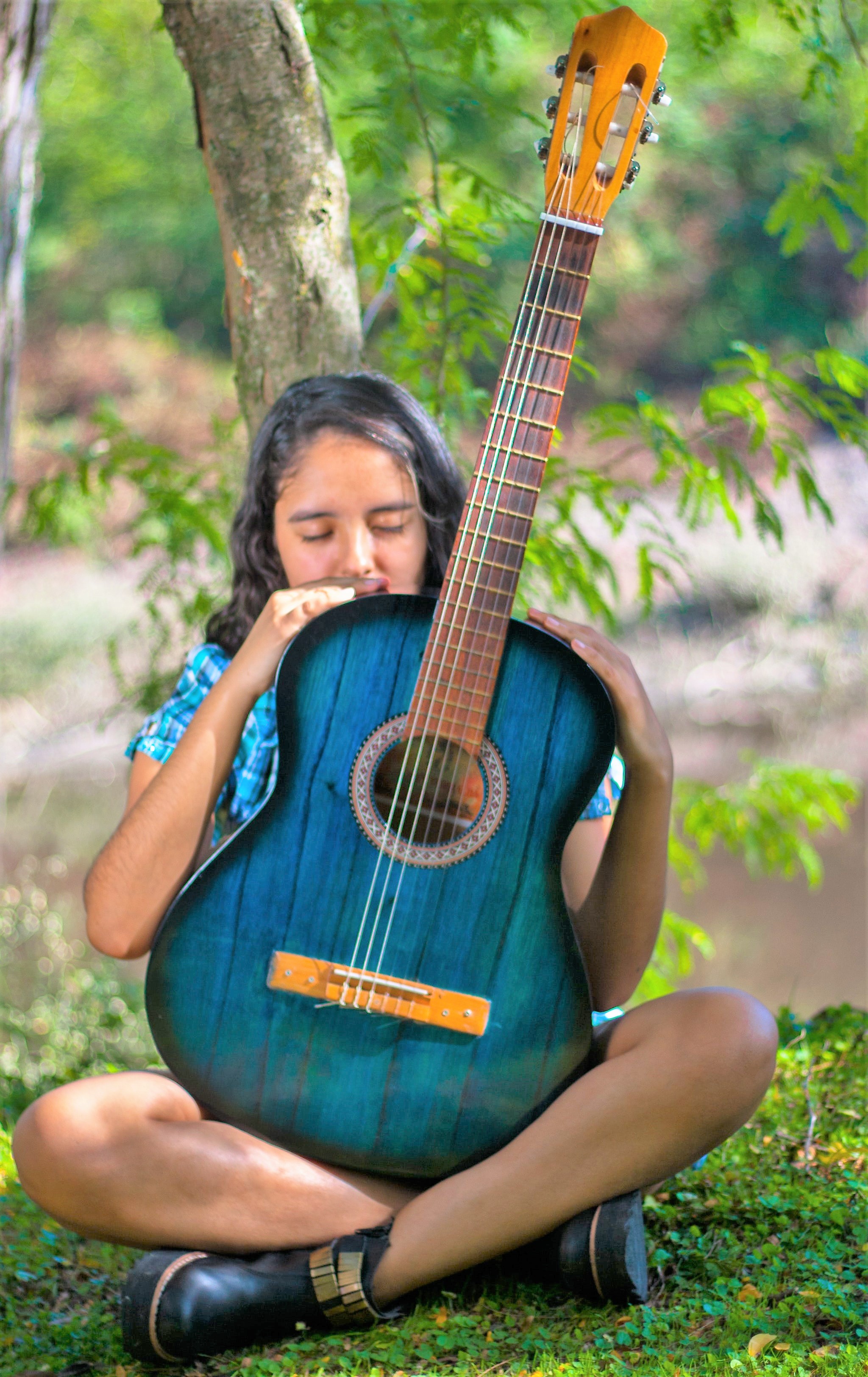 Guitar store with a bunch of guitars on the wall